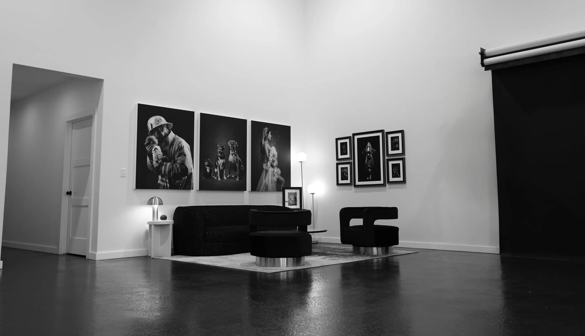 Portrait artwork and comfortable seating in the McKinney photography studio