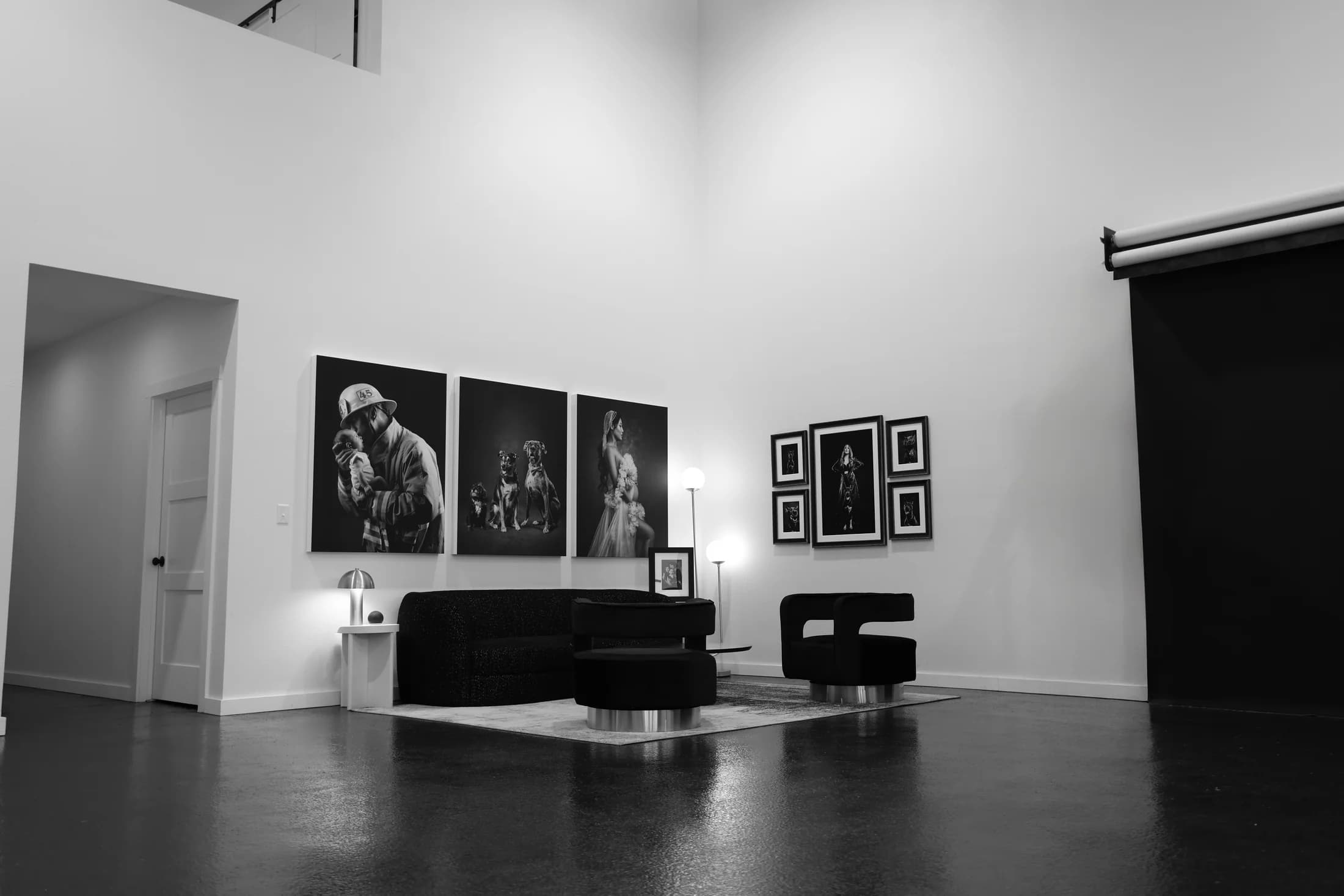 Portrait artwork above the seating area inside the McKinney studio